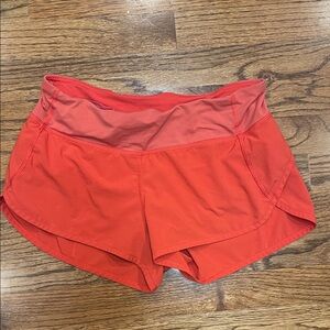 Lululemon orange speed up athletic shorts size 4
